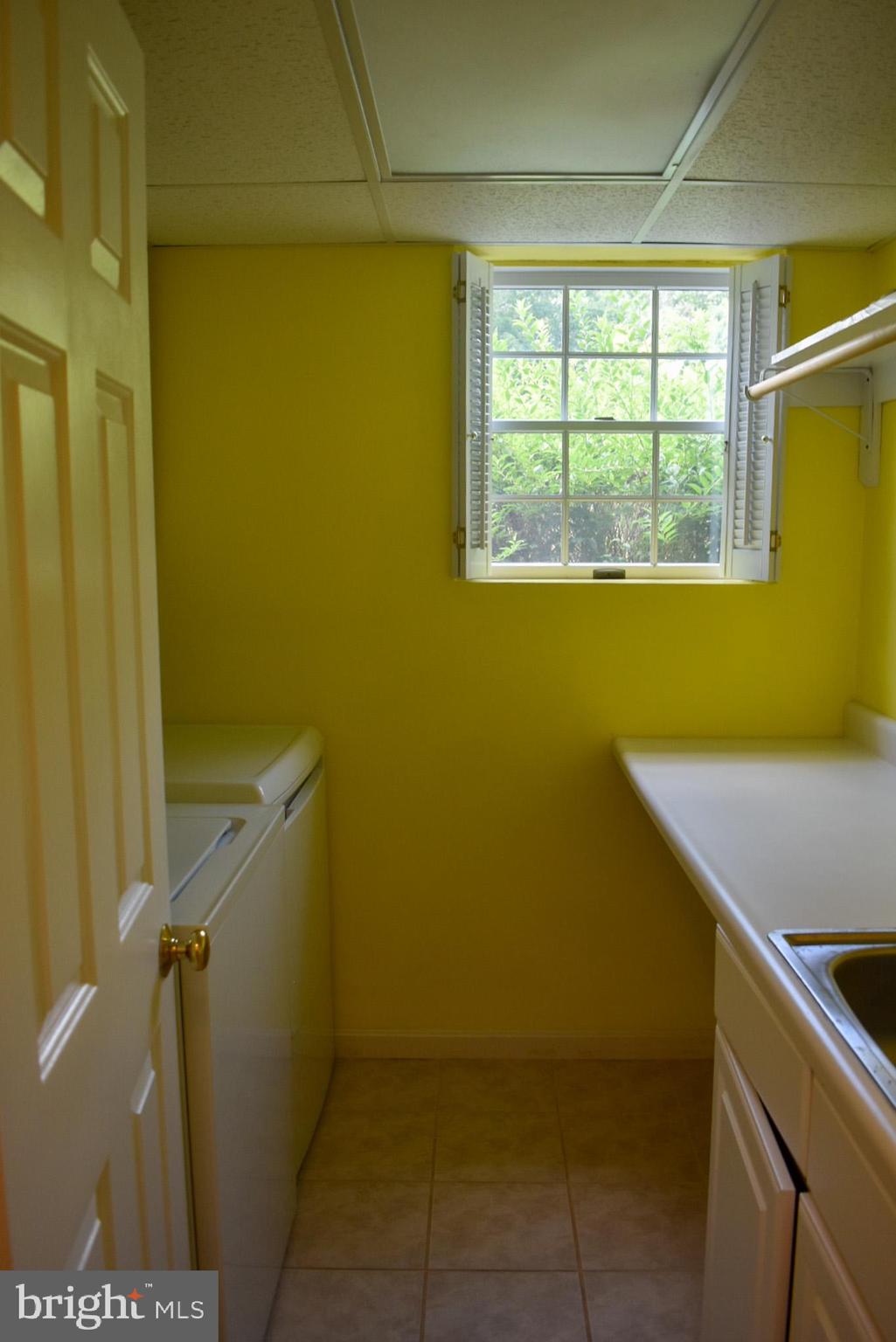15650 Gibson Mill Road Culpeper, VA 22701 - Photo 22 of 28 Bright and cheerful laundry nook with sunlight.