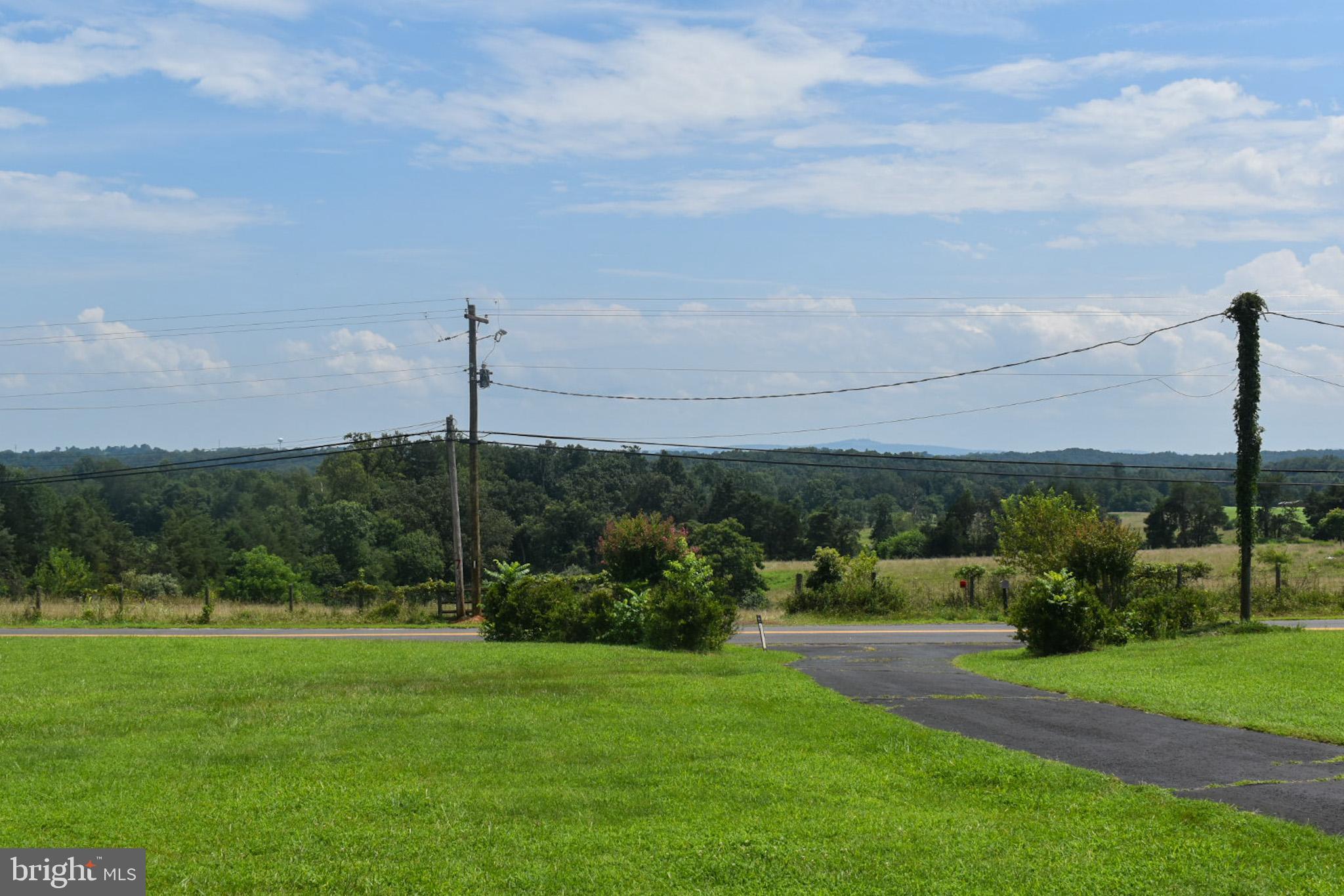 15650 Gibson Mill Road Culpeper, VA 22701 - Photo 3 of 28 Serene countryside view under blue skies.