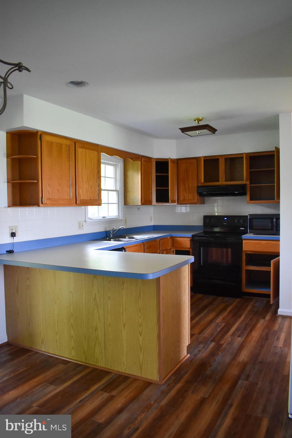 15650 Gibson Mill Road Culpeper, VA 22701 - Photo 8 of 28 Bright and inviting kitchen with wooden accents.