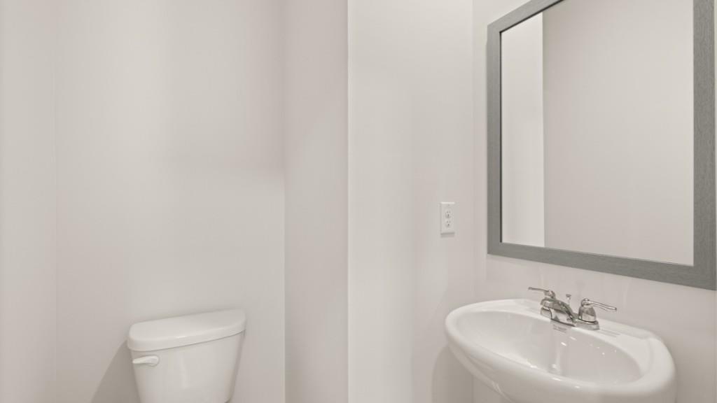 111 Babcock Drive Northeast Rome, GA 30165 - Photo 12 of 33 a bathroom with a toilet a sink and mirror