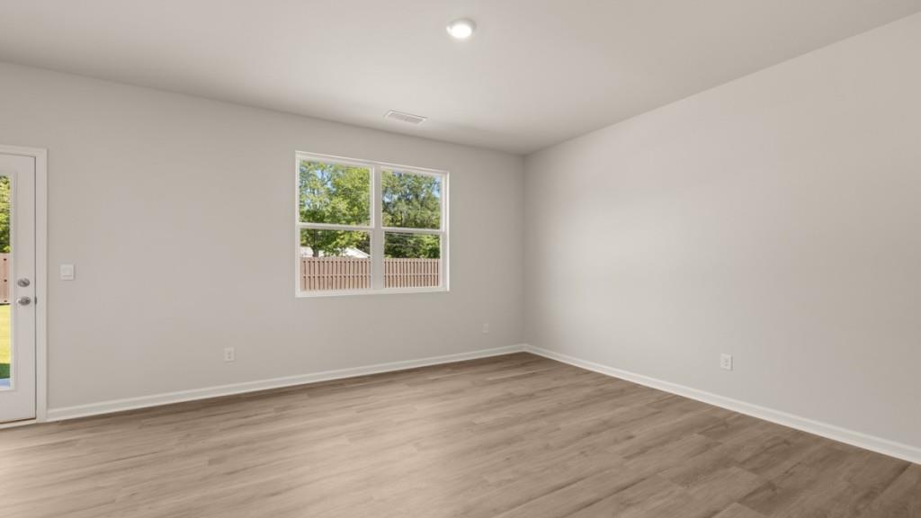 111 Babcock Drive Northeast Rome, GA 30165 - Photo 9 of 33 an empty room with wooden floor and windows