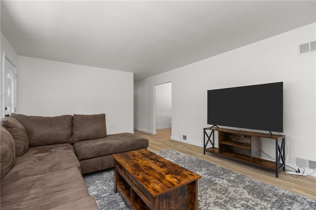 952 Achortown Road Beaver Falls, PA 15010 - Photo 14 of 43 a living room with furniture and a flat screen tv