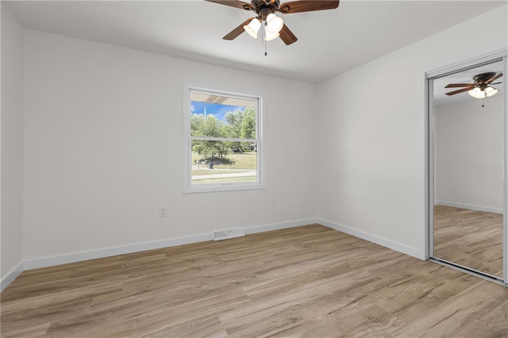 952 Achortown Road Beaver Falls, PA 15010 - Photo 15 of 43 wooden floor in an empty room with a window