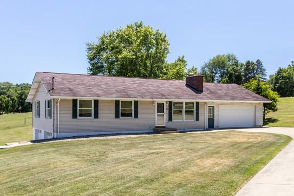 952 Achortown Road Beaver Falls, PA 15010 - Photo 2 of 43 a front view of a house with a garden