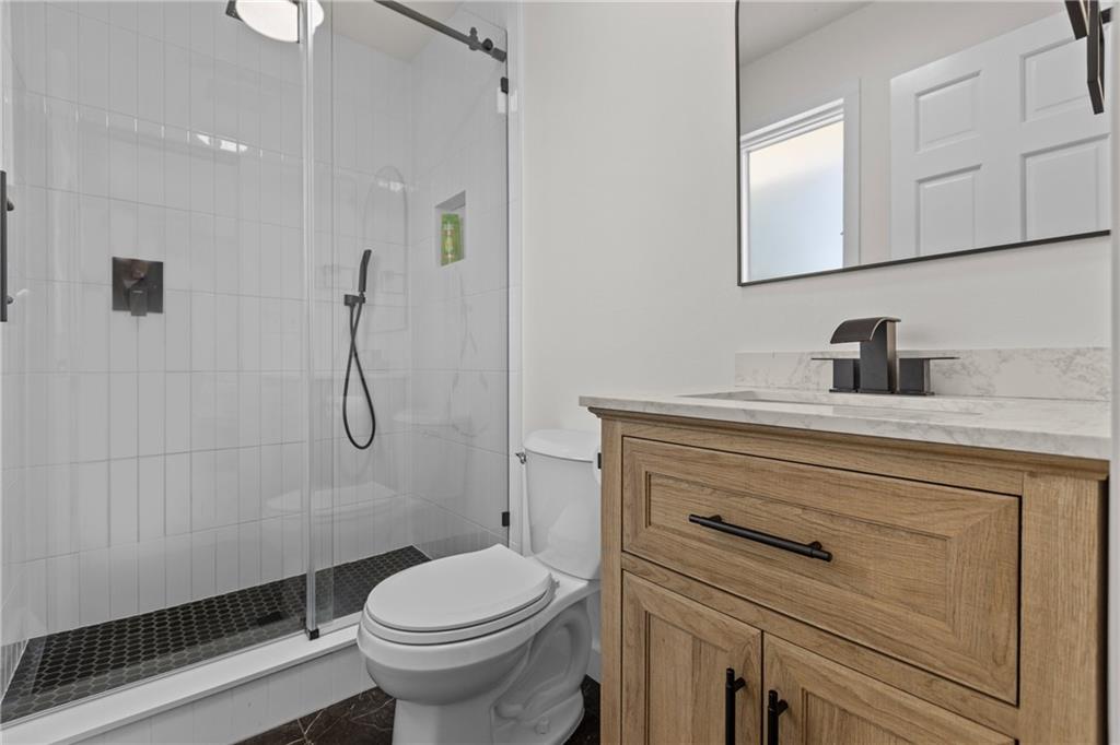 952 Achortown Road Beaver Falls, PA 15010 - Photo 24 of 43 a bathroom with a sink a toilet and shower