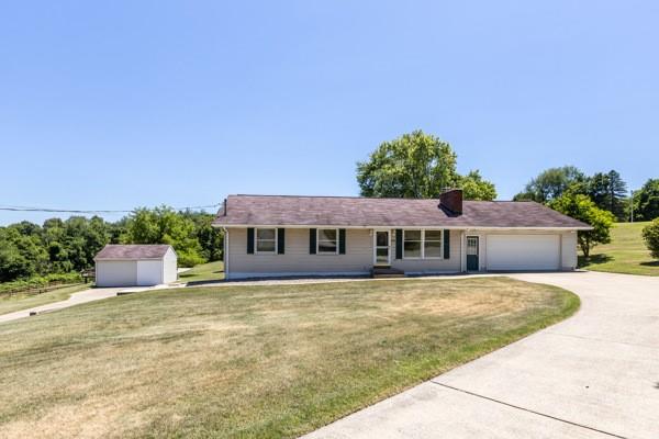 952 Achortown Road Beaver Falls, PA 15010 - Photo 3 of 43 a front view of a house with a garden and yard