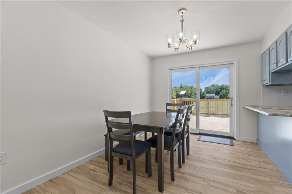 952 Achortown Road Beaver Falls, PA 15010 - Photo 6 of 43 a view of a dining room with furniture window and wooden floor