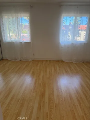 a bathroom with a toilet sink vanity and mirror
