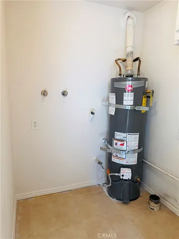 a kitchen with stainless steel appliances kitchen island granite countertop a refrigerator and a stove top oven