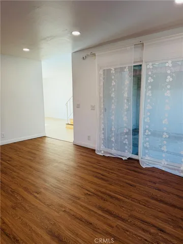 a view of a room with rack and wooden floor
