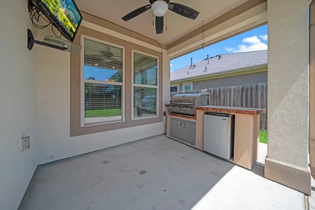 a kitchen with stainless steel appliances kitchen island granite countertop a sink and cabinets