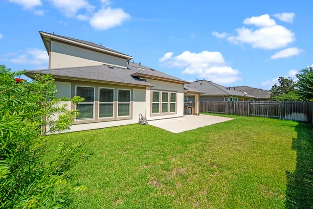 a house view with a garden space