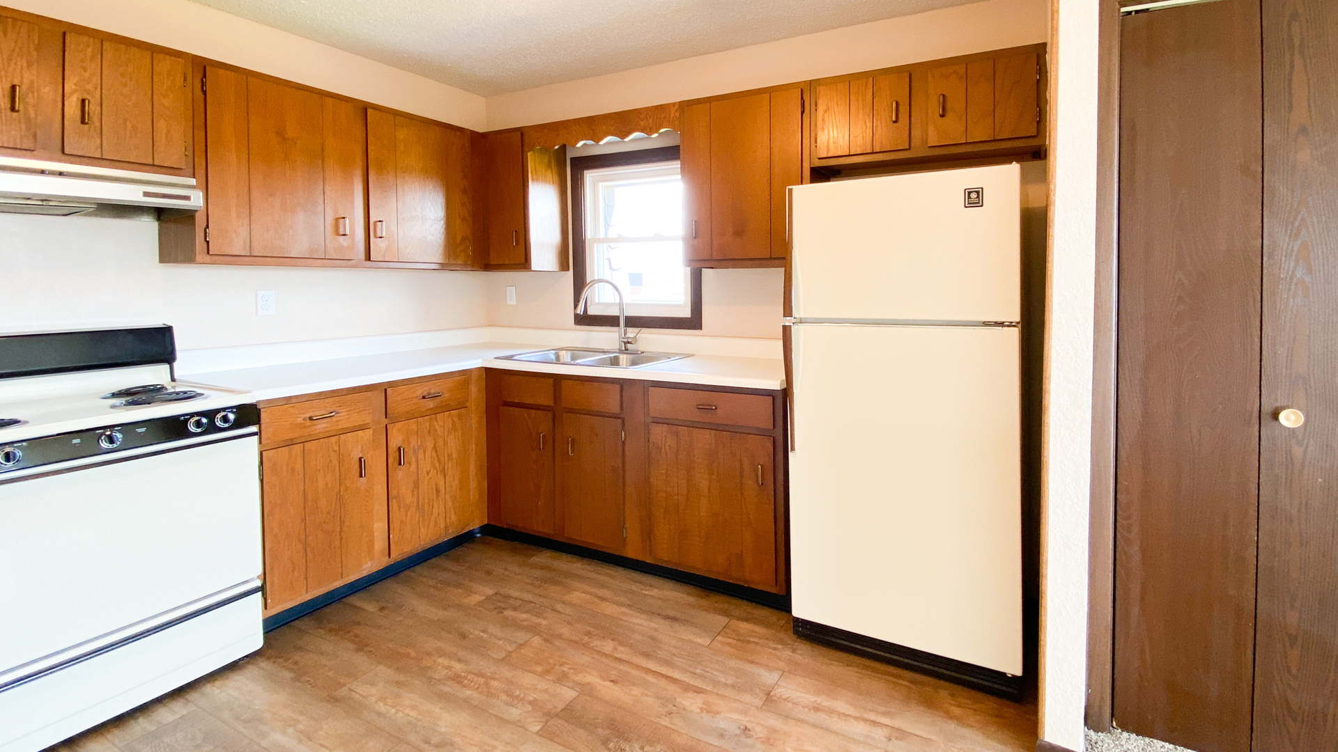 2 Michael Street, Unit 1 Streator, IL 61364 - Photo 2 of 8 a kitchen with a refrigerator sink stove and cabinets