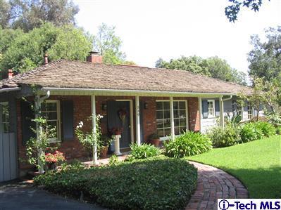 Undisclosed Address Pasadena, CA 91105 - Photo 1 of 9 a view of a house with a yard