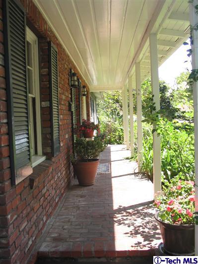 Undisclosed Address Pasadena, CA 91105 - Photo 2 of 9 a view of a porch with plants and garden