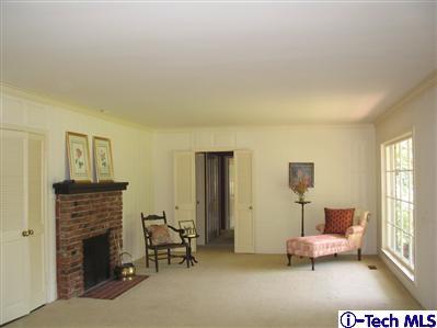 Undisclosed Address Pasadena, CA 91105 - Photo 3 of 9 a living room with furniture and a fireplace