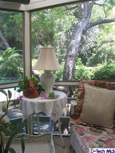 Undisclosed Address Pasadena, CA 91105 - Photo 7 of 9 a table and chairs in front of a yard