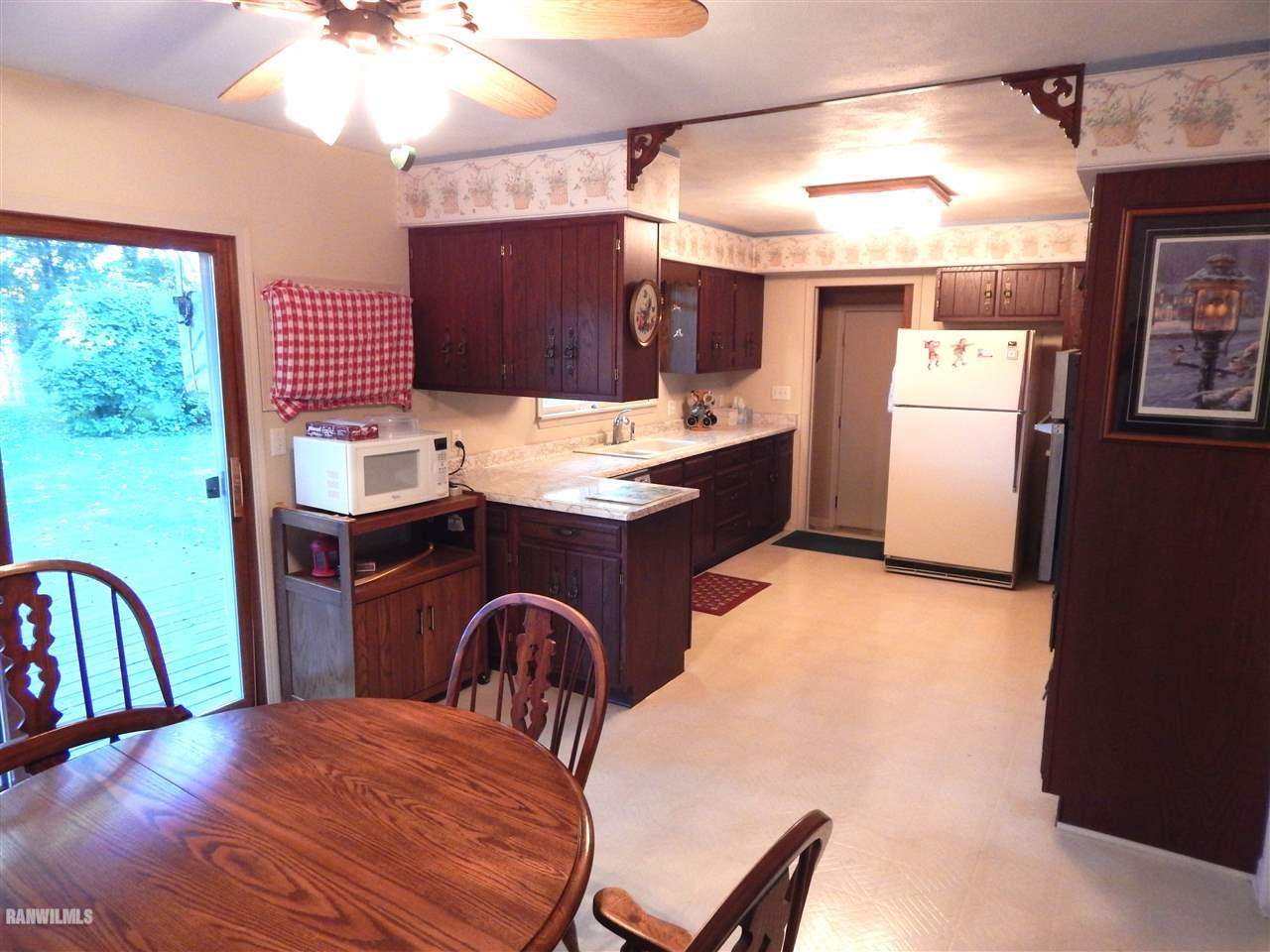 5164 Morrison Road Chadwick, IL 61014 - Photo 6 of 23 a kitchen with a table and chairs