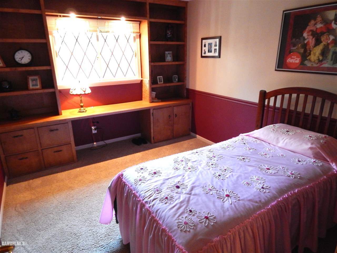 5164 Morrison Road Chadwick, IL 61014 - Photo 8 of 23 a bedroom with a bed and a dresser