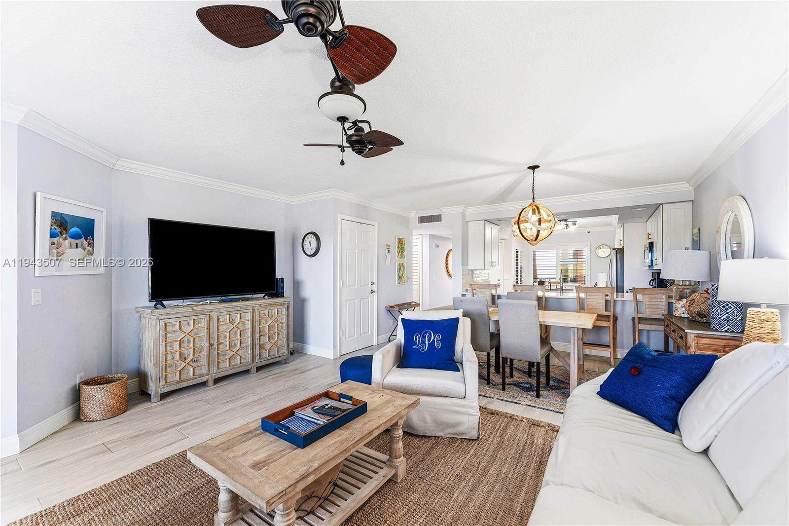 275 Palm Avenue, Unit B207 Jupiter, FL 33477 - Photo 11 of 29 a living room with furniture and a flat screen tv