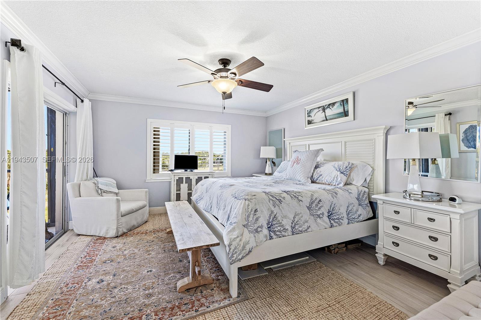 275 Palm Avenue, Unit B207 Jupiter, FL 33477 - Photo 17 of 29 a bedroom with a bed a couch and a dresser