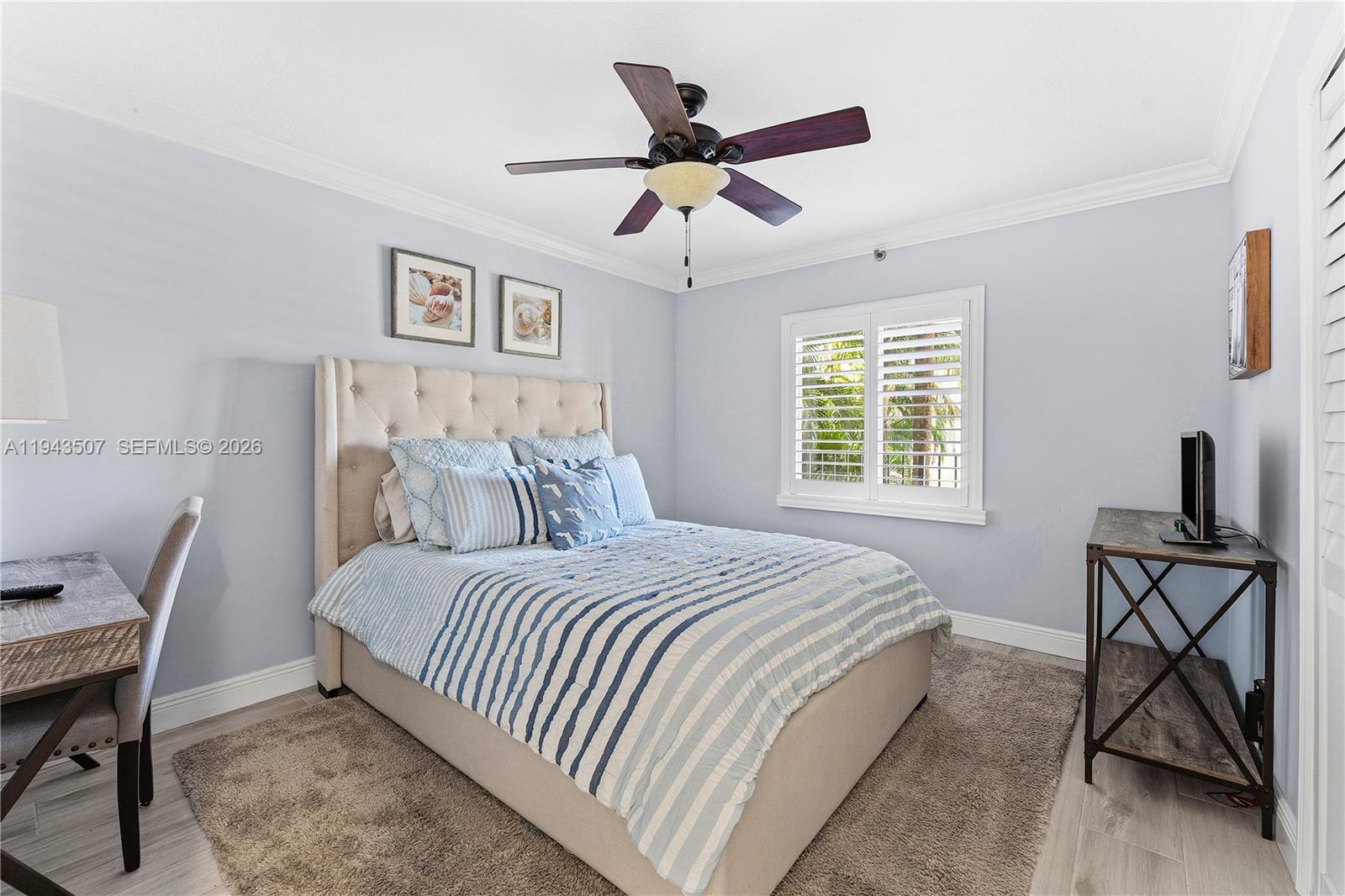 275 Palm Avenue, Unit B207 Jupiter, FL 33477 - Photo 18 of 29 a bedroom with a bed a desk and chair