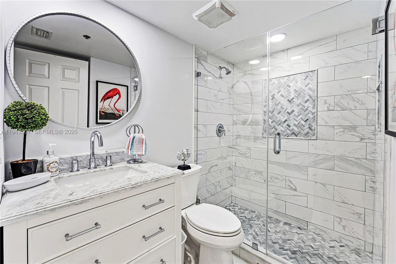 275 Palm Avenue, Unit B207 Jupiter, FL 33477 - Photo 19 of 29 a bathroom with a toilet sink and shower