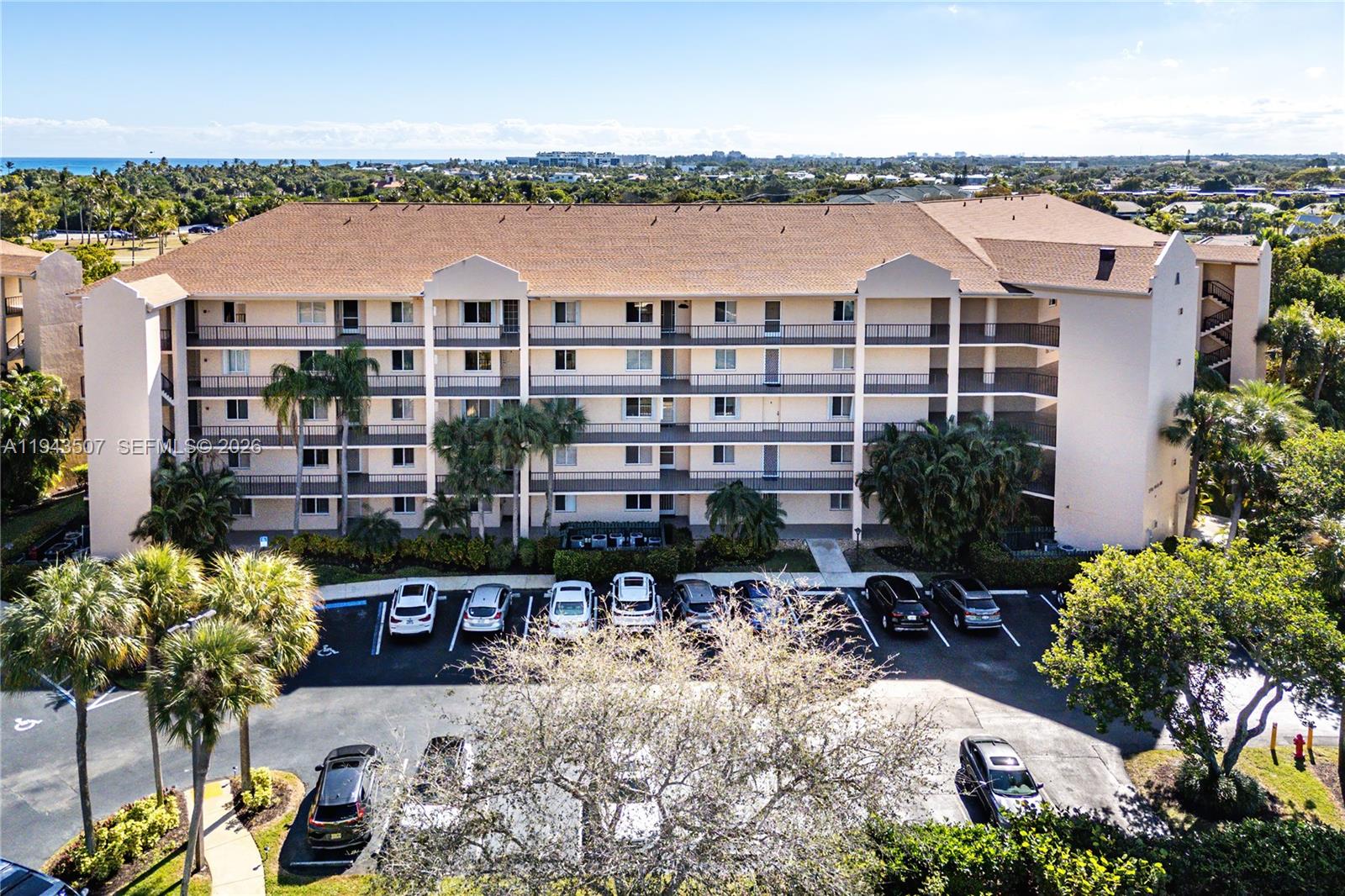 275 Palm Avenue, Unit B207 Jupiter, FL 33477 - Photo 23 of 29 a view of a lake with building in front of it