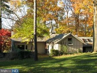 520 Huston Road St. Davids, PA 19087 - Photo 4 of 4 a front view of a house with a yard and garage