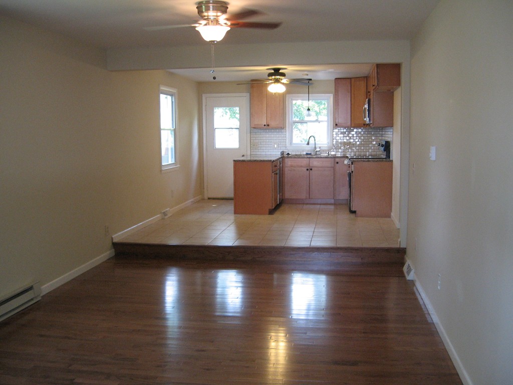 25 Quebec Street Chicopee, MA 01020 - Photo 3 of 7 a kitchen with granite countertop a sink cabinets and wooden floor