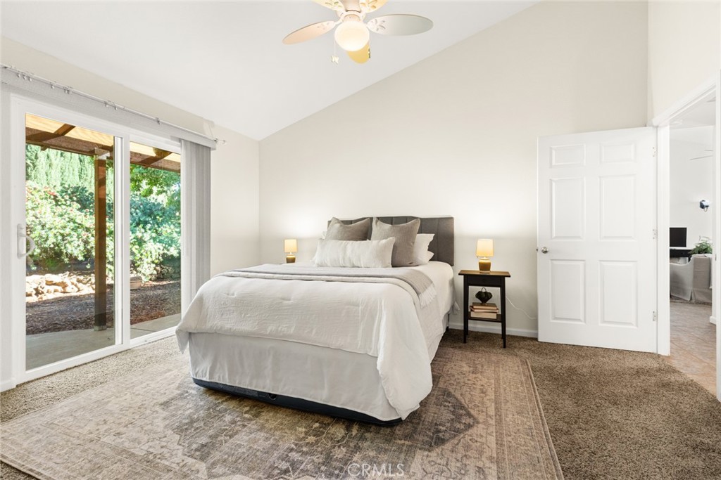 38 Lacewing Court Chico, CA 95973 - Photo 17 of 46 a bedroom with a bed and a chandelier