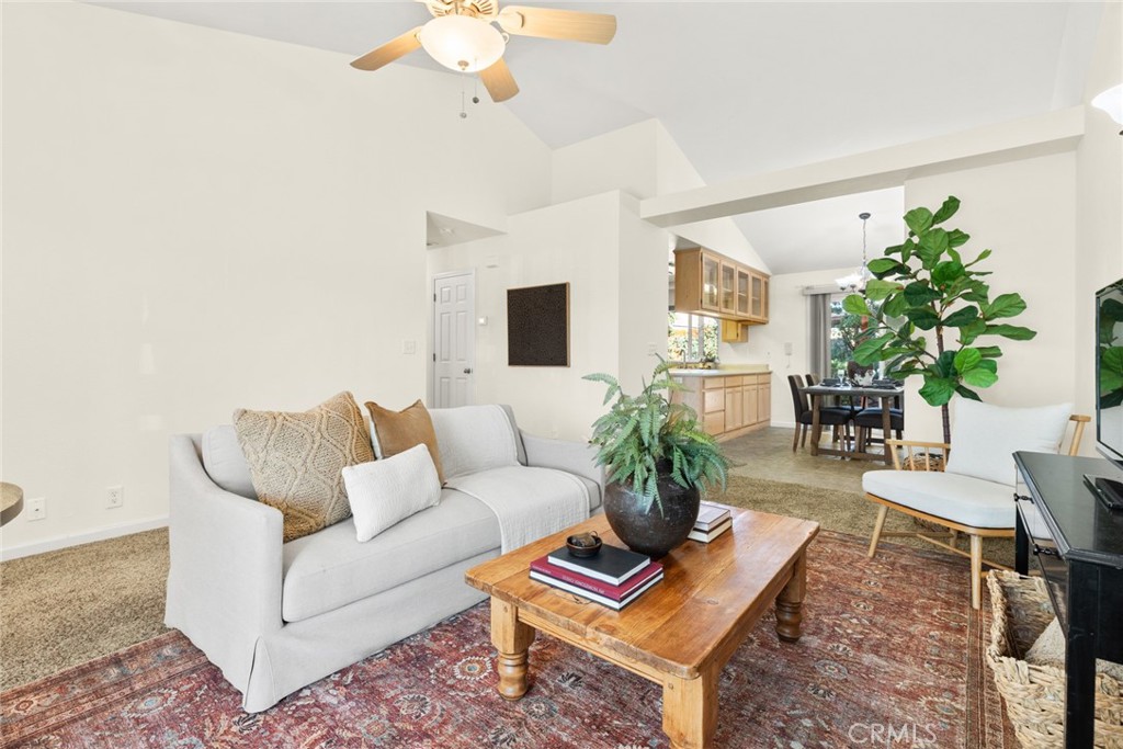 38 Lacewing Court Chico, CA 95973 - Photo 6 of 46 a living room with furniture a chandelier and a rug