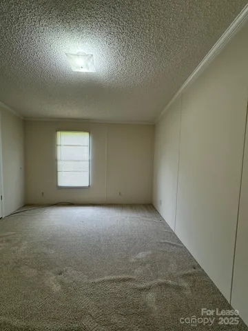 an empty room with a empty space and windows