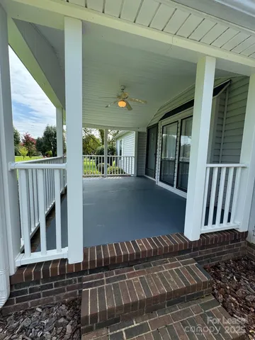 a view of balcony with wooden floor