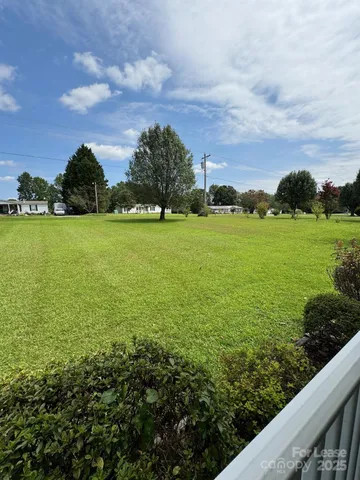 a view of a field with an ocean