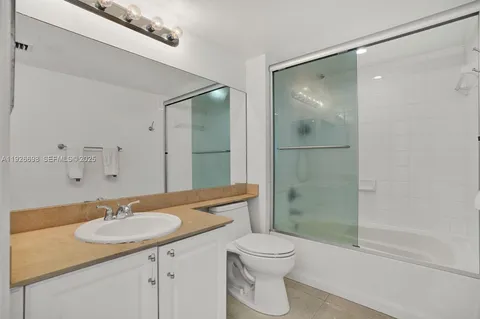 a bathroom with a shower and a toilet
