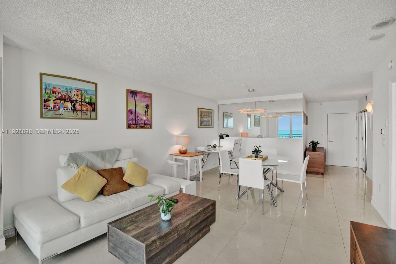 90 Alton Road, Unit 2907 Miami Beach, FL 33139 - Photo 22 of 42 a living room with furniture and a table