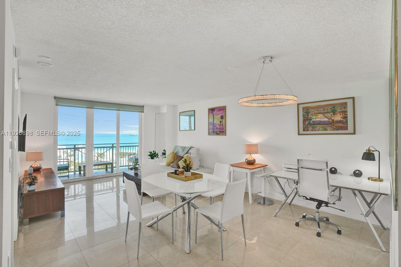 90 Alton Road, Unit 2907 Miami Beach, FL 33139 - Photo 25 of 42 a view of a dining room with furniture