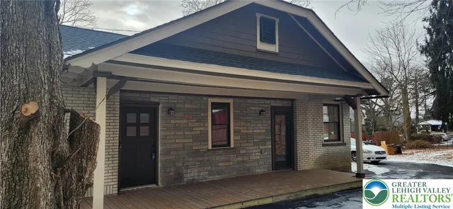 a front view of a house with garage
