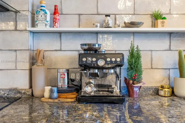 a kitchen with a stove and cabinets
