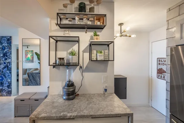 a kitchen with a sink and a stove top oven