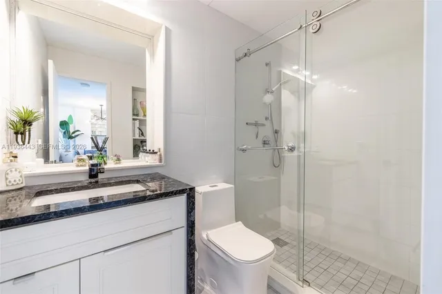 a kitchen with a sink a refrigerator and window