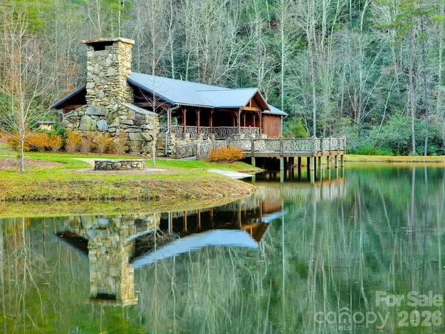 a balcony with table and chairs