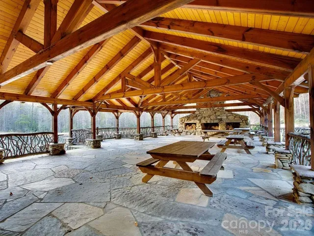 a view of a backyard with sitting area