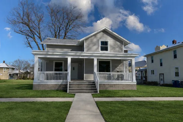 a front view of a house with a yard