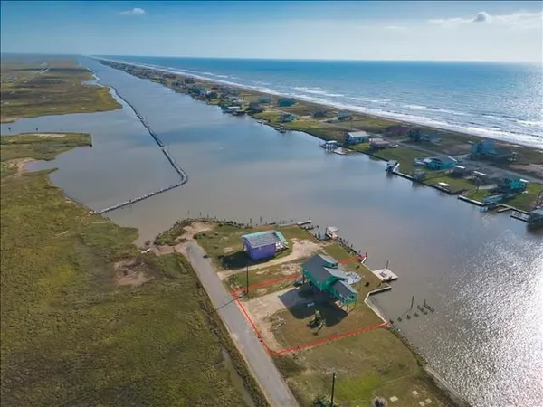 an aerial view of a house with a lake view