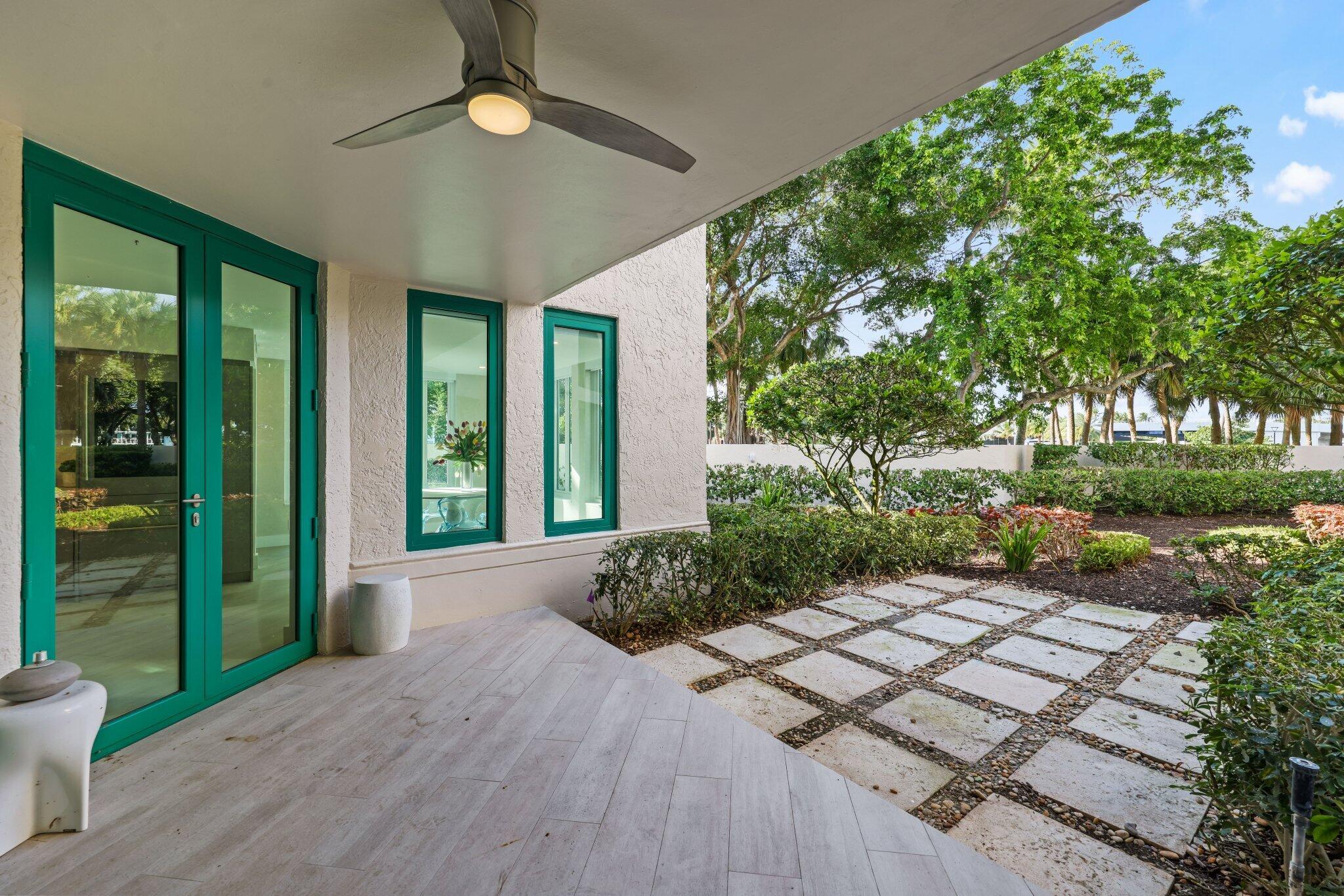 100 Southeast 5th Avenue, Unit 106 Boca Raton, FL 33432 - Photo 20 of 81 a view of a garden with porch