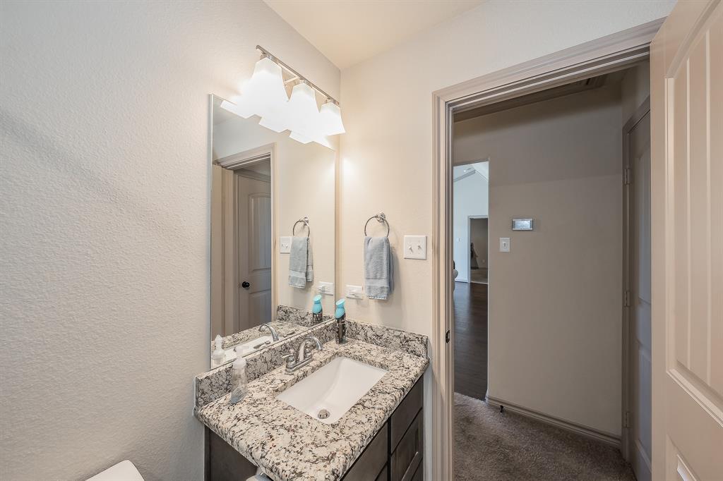 2376 Farm To Market Road 2264 Decatur, TX 76234 - Photo 15 of 39 a bathroom with a granite countertop sink and a mirror
