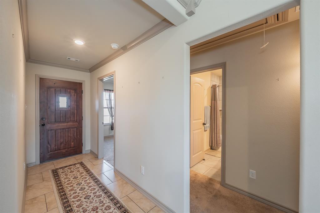 2376 Farm To Market Road 2264 Decatur, TX 76234 - Photo 18 of 39 a view of a hallway with a glass door and a bathroom
