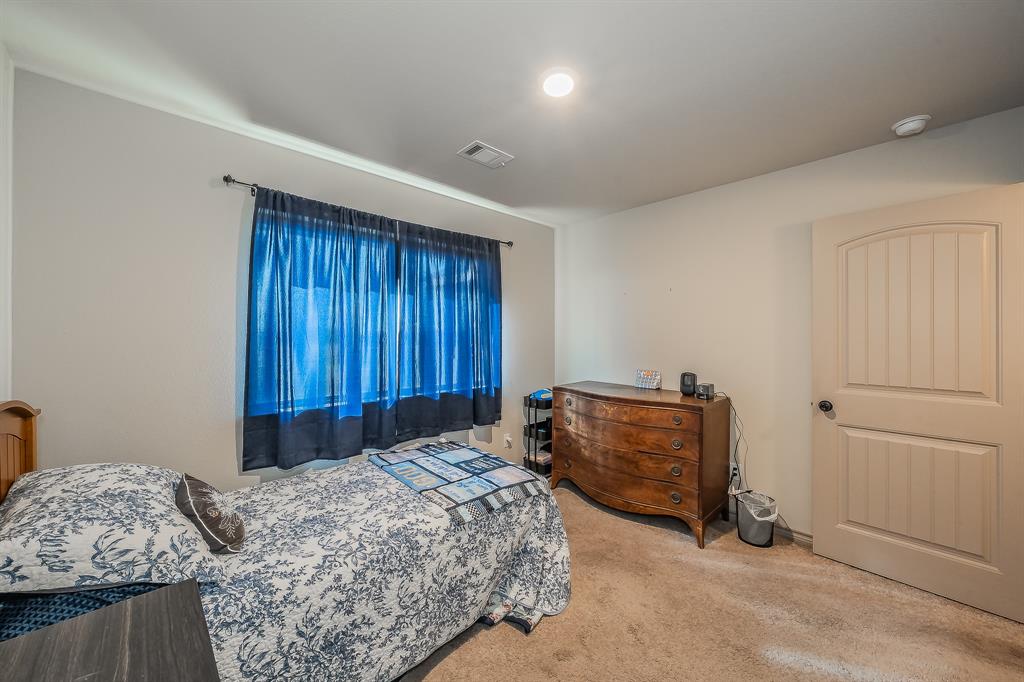 2376 Farm To Market Road 2264 Decatur, TX 76234 - Photo 19 of 39 a bedroom with a bed and a window
